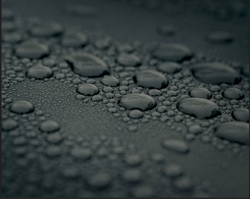 Water beading on a sealed concrete surface